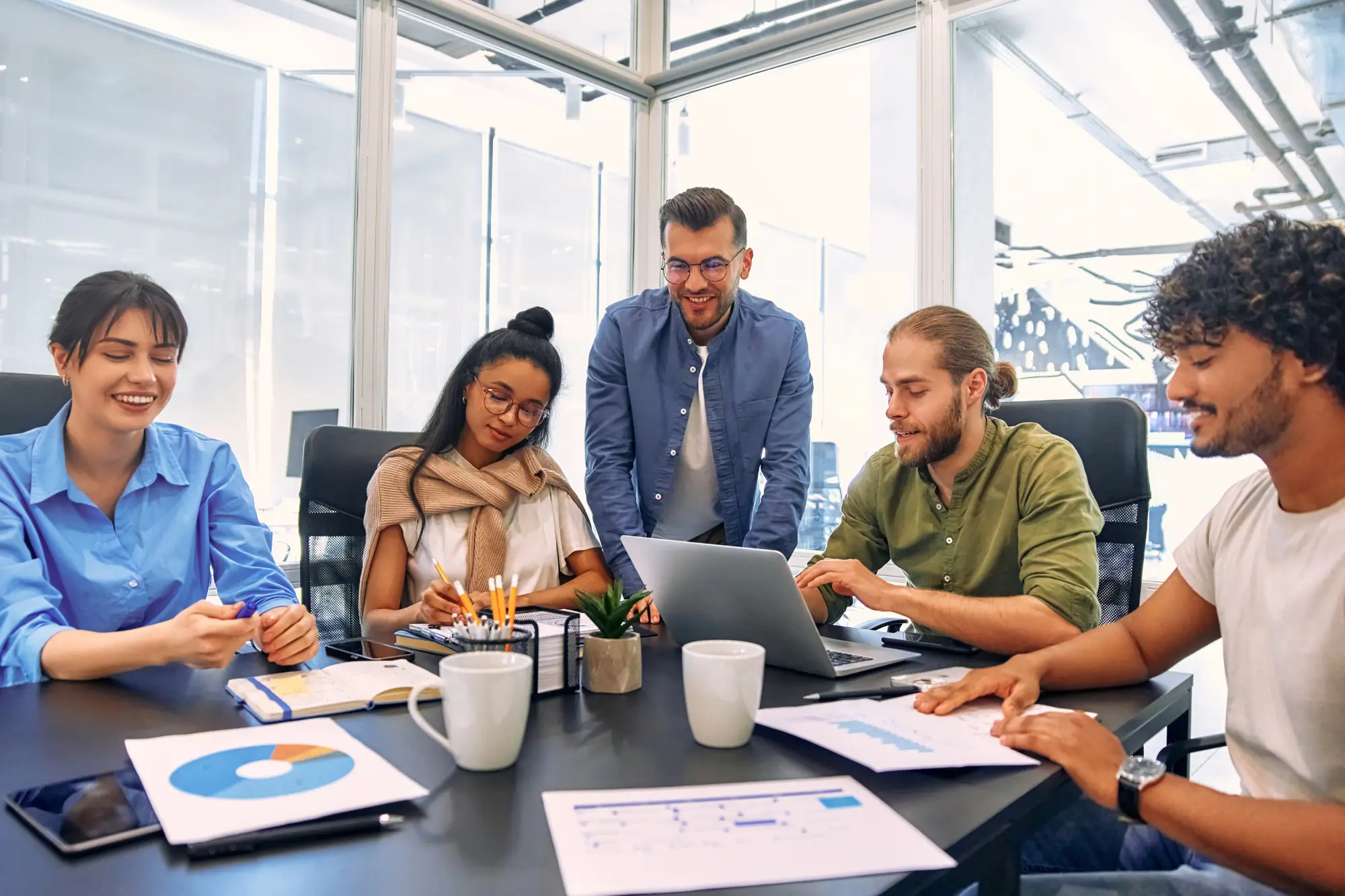 multiracial-young-creative-people-modern-office-group-young-business-people-are-working-together-with-laptop-tablet-smart-phone-notebook-successful-hipster-team-coworking-freelancers